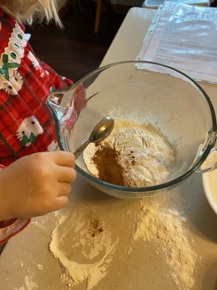 Gwen pouring in cocoa powder